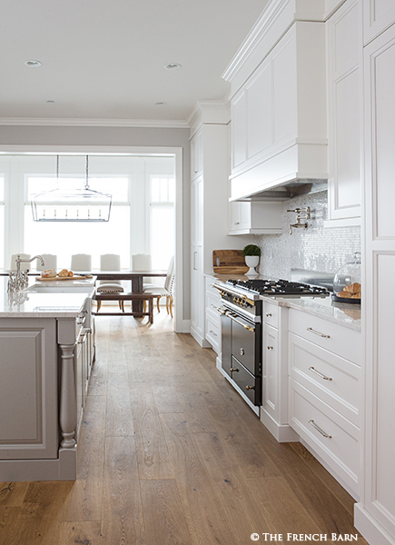 Large open kitchen with custom-made wood table