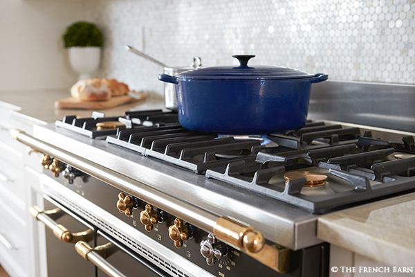 Lacanche range top with blue Le Creuset