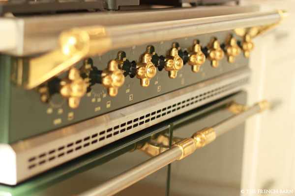 Close-up of Lacanche brass knobs